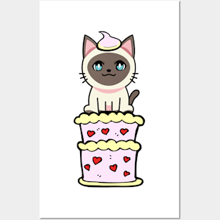 Funny siamese cat jumping out of a cake Posters and Art